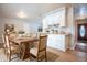 Farmhouse-style dining room adjacent to kitchen at 1707 E 45Th St, Anderson, IN 46013