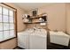 Clean laundry room with washer, dryer, and utility sink at 2068 Saunders Field Dr, Avon, IN 46123