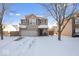 Two-story house with gray siding, a two-car garage, and a snow-covered front yard at 2359 Shoemaker Ct, Indianapolis, IN 46229