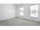 Bright bedroom with gray carpeting and two windows at 2541 Royal Blvd, Carmel, IN 46032