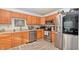 Modern kitchen with stainless steel appliances and wood cabinets at 2925 Everbloom Pl, Indianapolis, IN 46217