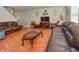 Spacious living room featuring hardwood floors and comfy furniture at 2925 Everbloom Pl, Indianapolis, IN 46217