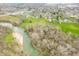 Overhead view of property near river with lush greenery, offering tranquility and outdoor opportunities at 2940 Washington St, Columbus, IN 47201