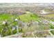 Stunning aerial view of a neighborhood highlighting homes with mature trees and well-maintained landscaping at 2940 Washington St, Columbus, IN 47201