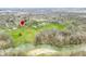 Expansive aerial view of a secluded property with river frontage, lush greenery, and mature trees at 2940 Washington St, Columbus, IN 47201