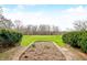 Manicured backyard features landscaping, and brick walkways at 2940 Washington St, Columbus, IN 47201