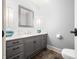 Elegant bathroom with gray vanity, marble countertop, and tile floor at 2940 Washington St, Columbus, IN 47201