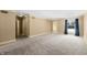Large bedroom with neutral carpeting, ample closet space, and window at 2940 Washington St, Columbus, IN 47201