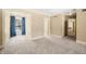 Bright bedroom with window, built-in shelving and neutral carpeting at 2940 Washington St, Columbus, IN 47201