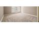Bedroom with neutral carpeting and French doors to the outdoors at 2940 Washington St, Columbus, IN 47201