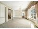 Formal dining room featuring a chandelier and large windows at 2940 Washington St, Columbus, IN 47201