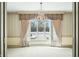 Dining room with bay window and a crystal chandelier at 2940 Washington St, Columbus, IN 47201
