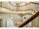 Elegant entryway with curved staircase, chandelier, and detailed millwork at 2940 Washington St, Columbus, IN 47201