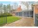 Charming brick home with screened porch and black ornate fence at 2940 Washington St, Columbus, IN 47201