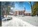 Front view of brick home with snow covered landscaping at 2940 Washington St, Columbus, IN 47201