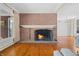 Brick fireplace with a glass fire screen in a living room at 2940 Washington St, Columbus, IN 47201