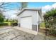 Single garage featuring durable metal siding, complemented by a fenced yard for added privacy at 2940 Washington St, Columbus, IN 47201