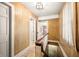 Upper hallway with wood paneling, tile floors, and a staircase at 2940 Washington St, Columbus, IN 47201