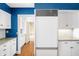 Modern kitchen with white cabinets, stainless steel appliances, and concrete countertops at 2940 Washington St, Columbus, IN 47201