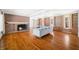 Living room with hardwood floors, built-in shelving, and a cozy fireplace at 2940 Washington St, Columbus, IN 47201