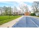 Large backyard pool with cover and brick home with black fence at 2940 Washington St, Columbus, IN 47201