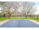 Covered pool with blossoming trees in the background and black fence at 2940 Washington St, Columbus, IN 47201