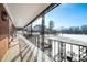 Covered porch with ornate railing overlooking a snow-covered yard at 2940 Washington St, Columbus, IN 47201