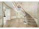 Elegant curved staircase with chandelier in entryway at 2940 Washington St, Columbus, IN 47201