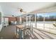 Bright sunroom with ample seating and views of the backyard at 2940 Washington St, Columbus, IN 47201