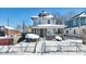Two-story house with brick front and covered porch, snow-covered yard at 2957 Winthrop Ave, Indianapolis, IN 46205