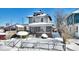 Two-story house with brick front and covered porch, snow-covered yard at 2957 Winthrop Ave, Indianapolis, IN 46205