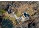 Aerial view of house, pond, and recreational area at 3264 W Roberts Rd, Trafalgar, IN 46181