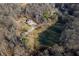 Aerial view of two houses and expansive property with pond at 3264 W Roberts Rd, Trafalgar, IN 46181