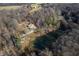 Aerial view of property with two houses and a pond at 3264 W Roberts Rd, Trafalgar, IN 46181