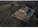 Aerial view showing home, pond, and surrounding landscape at 3264 W Roberts Rd, Trafalgar, IN 46181