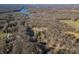 Aerial view of property showcasing home and pond at 3264 W Roberts Rd, Trafalgar, IN 46181