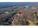 Aerial view of house near lake with location marker at 3264 W Roberts Rd, Trafalgar, IN 46181