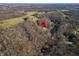 Aerial view showing home's location in a wooded area at 3264 W Roberts Rd, Trafalgar, IN 46181