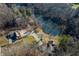 Aerial view of two houses and expansive property with pond at 3264 W Roberts Rd, Trafalgar, IN 46181