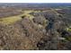 Aerial view of house nestled in woods near lake at 3264 W Roberts Rd, Trafalgar, IN 46181