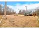 Open area with fire pit and mature trees, near home at 3264 W Roberts Rd, Trafalgar, IN 46181