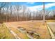 Large backyard with fire pit and mature trees at 3264 W Roberts Rd, Trafalgar, IN 46181