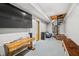 Finished basement with spiral staircase and media area at 3264 W Roberts Rd, Trafalgar, IN 46181
