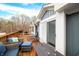 Large deck with seating area, fire pit, and access to home's interior at 3264 W Roberts Rd, Trafalgar, IN 46181