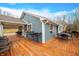 Deck with multiple seating areas and views of the backyard at 3264 W Roberts Rd, Trafalgar, IN 46181