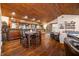 Rustic dining area with wood floors and built-in bar at 3264 W Roberts Rd, Trafalgar, IN 46181