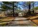 Gravel driveway leading to a house through a wooded area at 3264 W Roberts Rd, Trafalgar, IN 46181