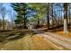 Long gravel driveway lined with trees, leading to house at 3264 W Roberts Rd, Trafalgar, IN 46181