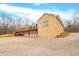 Stone and wood house exterior with large deck and spacious driveway at 3264 W Roberts Rd, Trafalgar, IN 46181