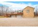 Stone and siding house with a large deck and a three-car garage at 3264 W Roberts Rd, Trafalgar, IN 46181